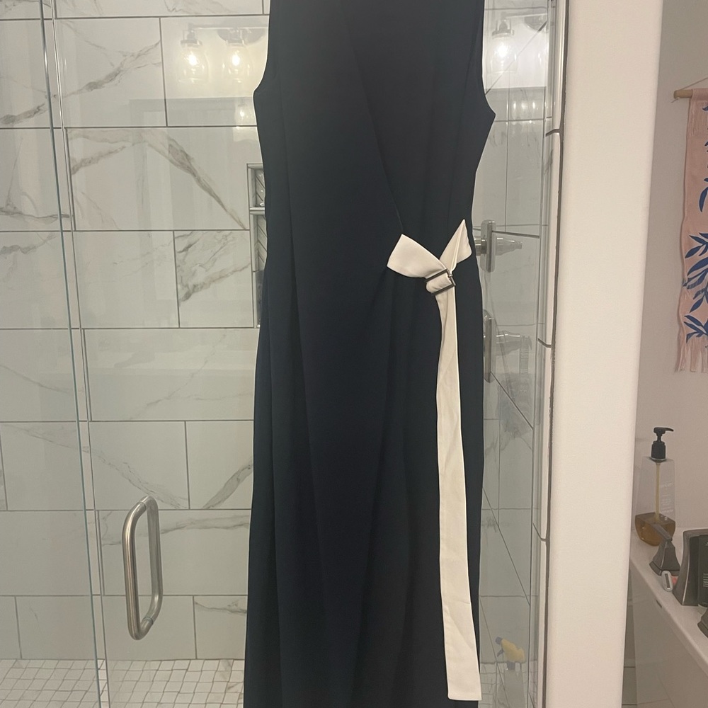 Navy Romper, worn one time. English size 12… fits like an 8 in US size